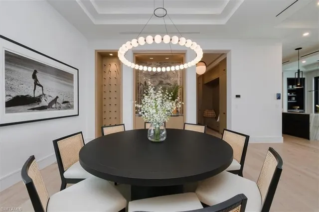a dining room with furniture and window