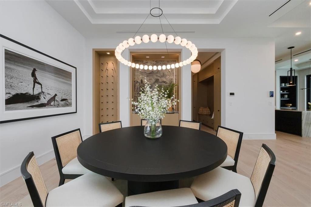 1640 Dolphin Court Naples, FL 34102 - Photo 17 of 45 a dining room with furniture and window