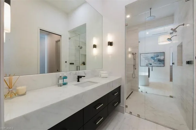 a spacious bathroom with a double vanity sink mirror and double