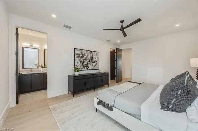 a bathroom with a double vanity sink mirror double shower and a bathtub