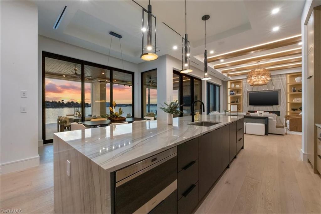 1640 Dolphin Court Naples, FL 34102 - Photo 4 of 45 a large kitchen with a counter space