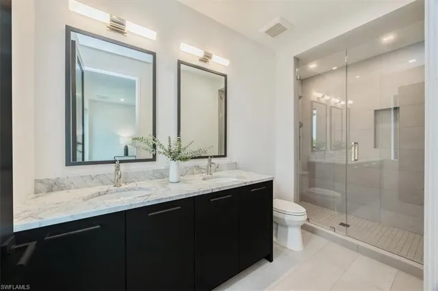 a utility room with sink dryer and washer