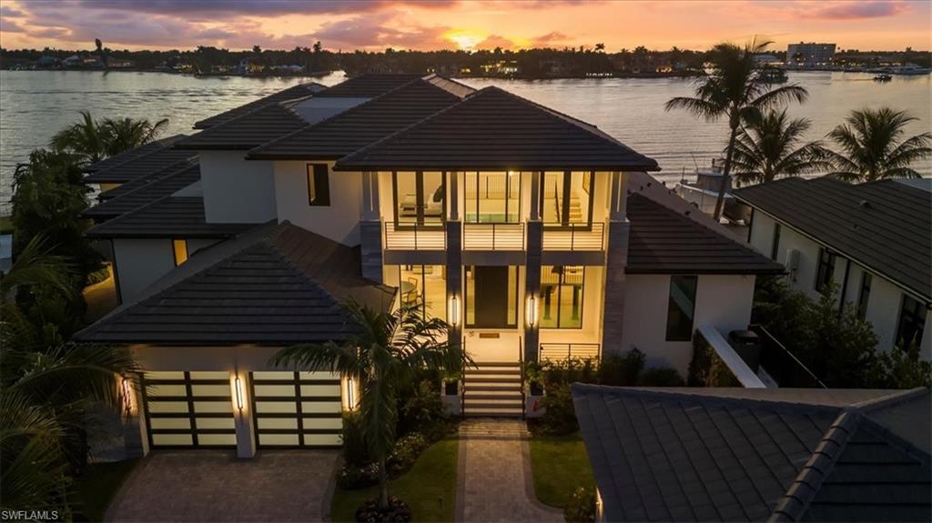 1640 Dolphin Court Naples, FL 34102 - Photo 43 of 45 a front view of a house with a yard