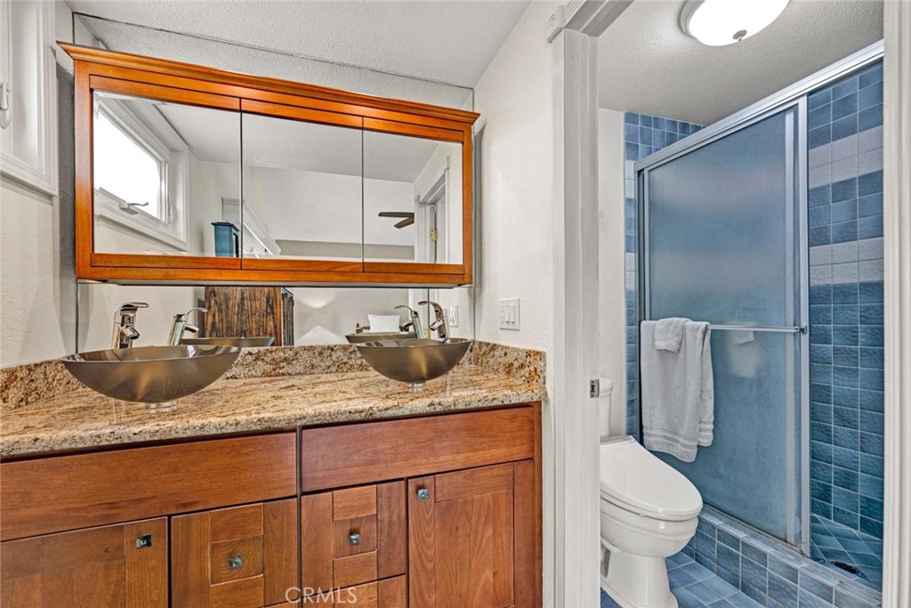 14682 Emerywood Road Tustin, CA 92780 - Photo 18 of 32 Primary bathroom with walk-in shower