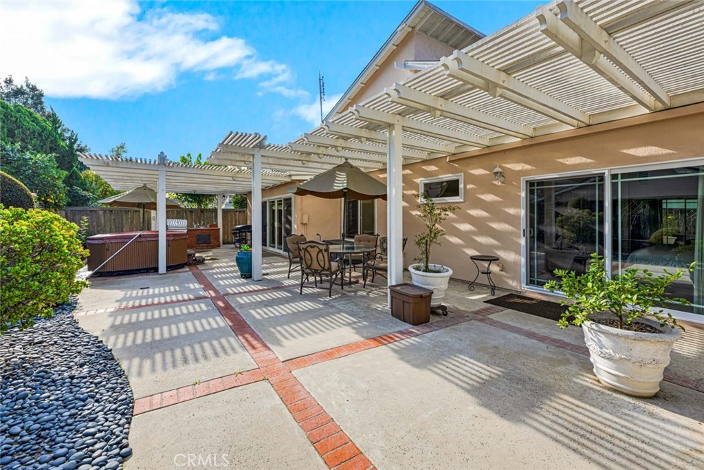 14682 Emerywood Road Tustin, CA 92780 - Photo 23 of 32 Enjoy the afternoon in the beautiful backyard and relax under the covered patio!