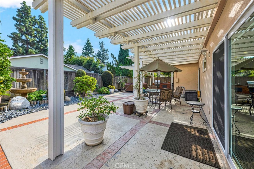 14682 Emerywood Road Tustin, CA 92780 - Photo 24 of 32 Enjoy the afternoon in the beautiful backyard and relax under the covered patio!