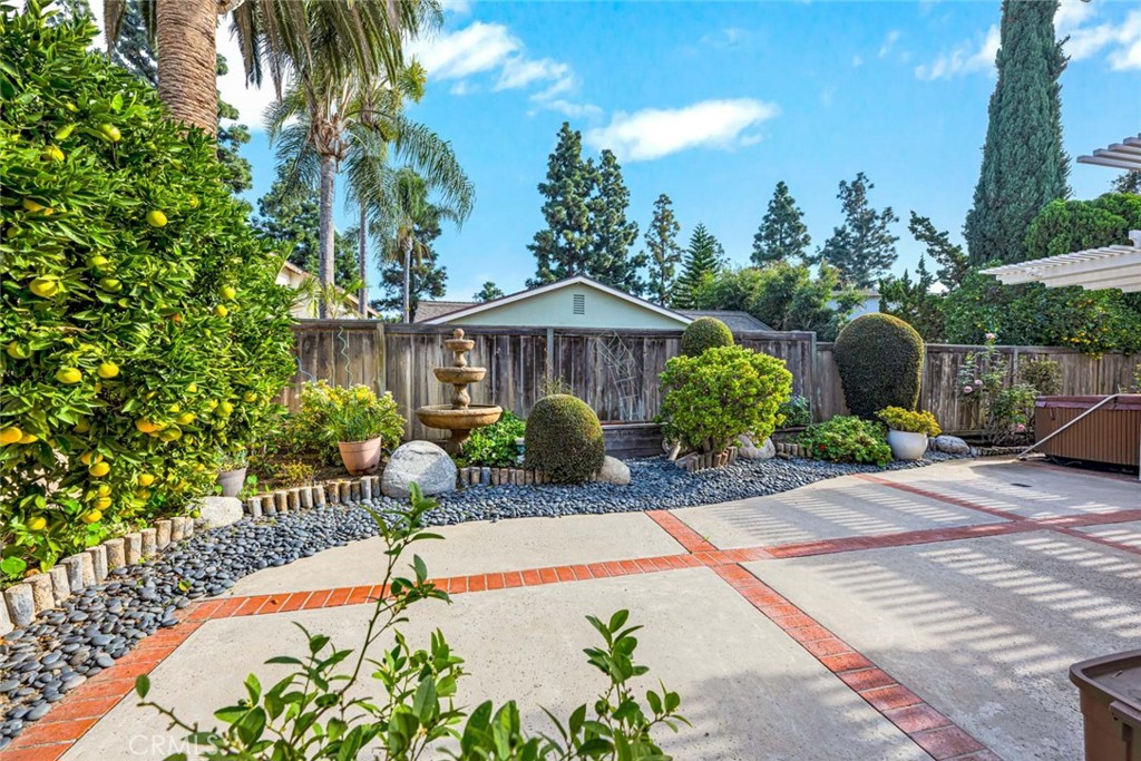 14682 Emerywood Road Tustin, CA 92780 - Photo 25 of 32 Enjoy the afternoon in the beautiful backyard and relax under the covered patio!
