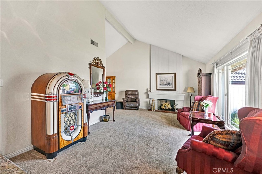 14682 Emerywood Road Tustin, CA 92780 - Photo 3 of 32 Bright living room with high ceilings and fireplace