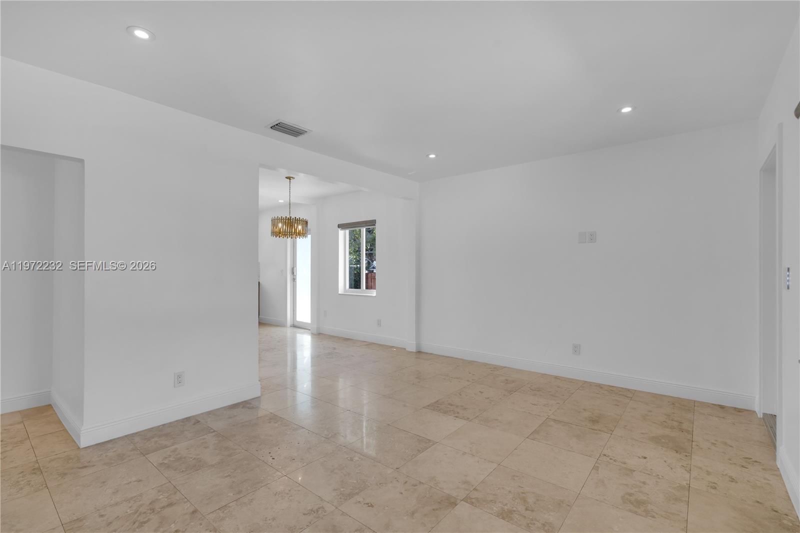 6376 Southwest 20th Street Miami, FL 33155 - Photo 11 of 42 an empty room with windows and entrance