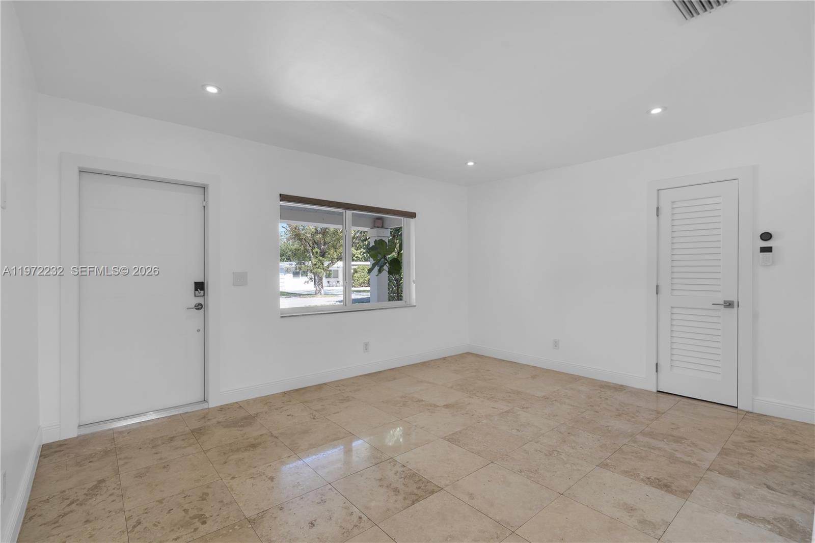 6376 Southwest 20th Street Miami, FL 33155 - Photo 12 of 42 a view of an empty room with a window