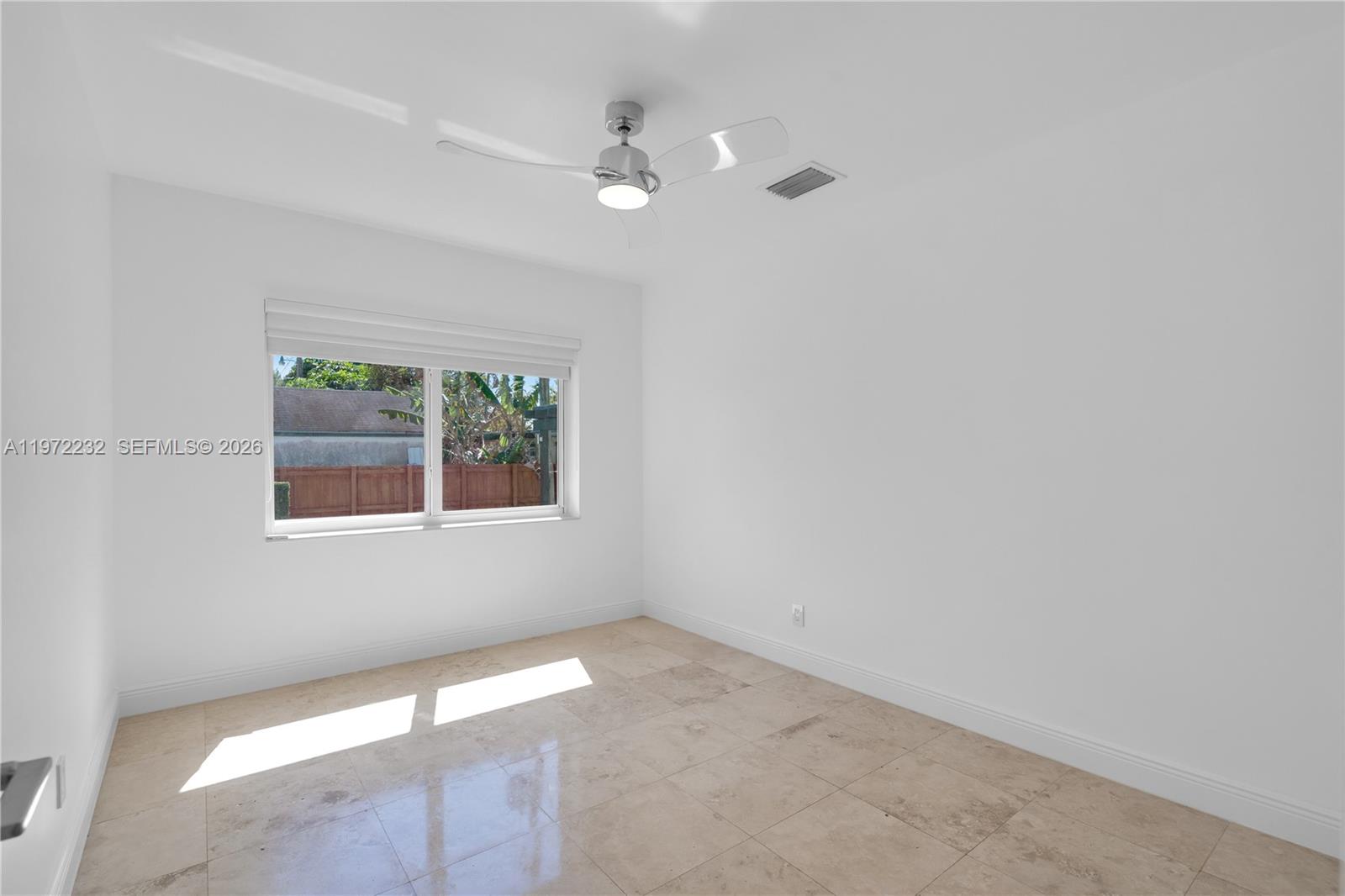 6376 Southwest 20th Street Miami, FL 33155 - Photo 13 of 42 a view of an empty room with a window
