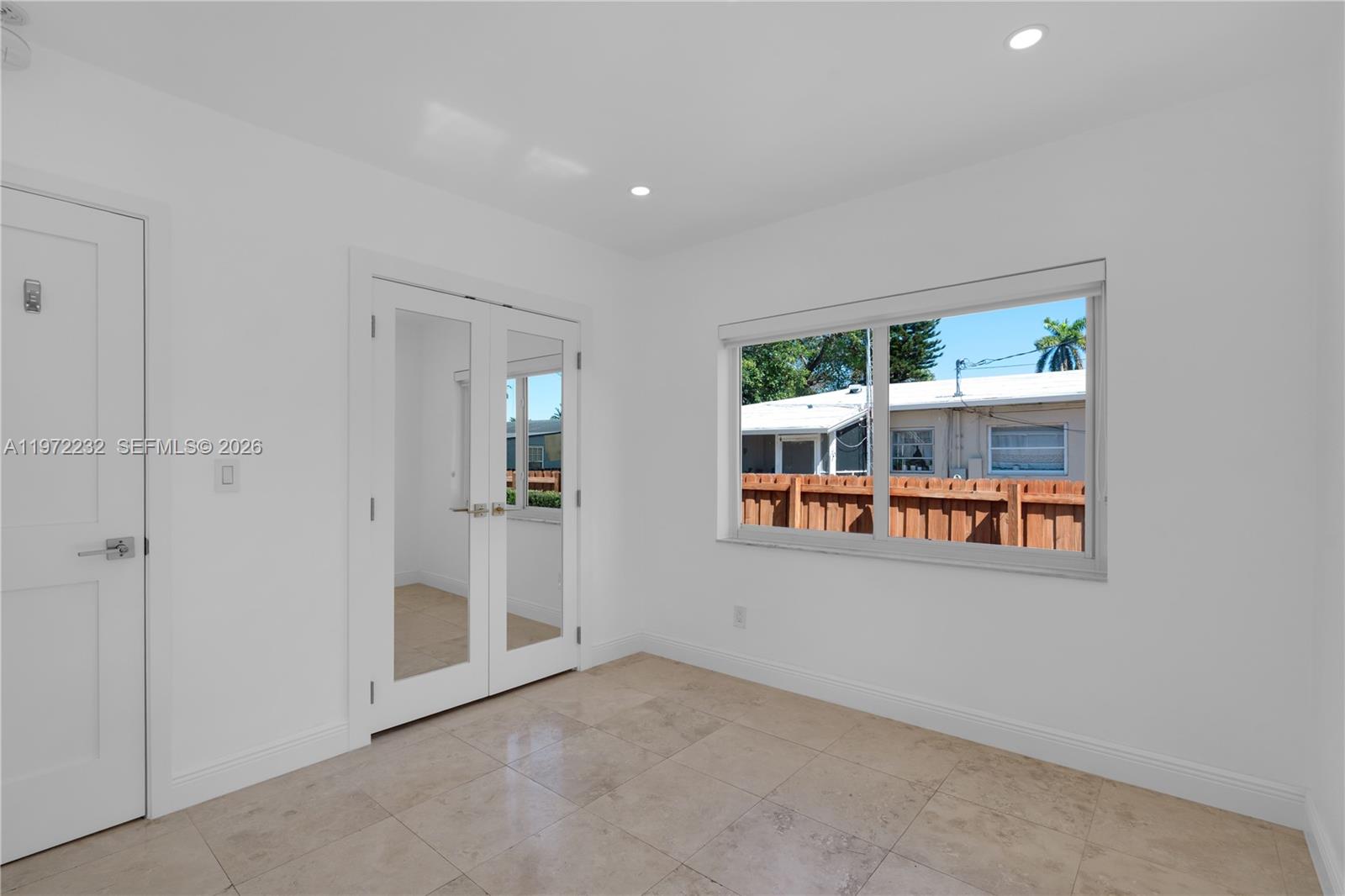 6376 Southwest 20th Street Miami, FL 33155 - Photo 18 of 42 an empty room with windows