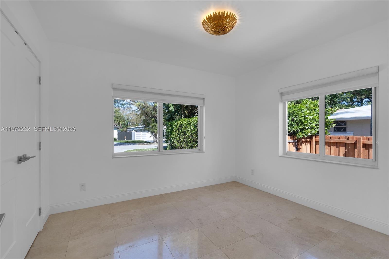 6376 Southwest 20th Street Miami, FL 33155 - Photo 20 of 42 an empty room with a window