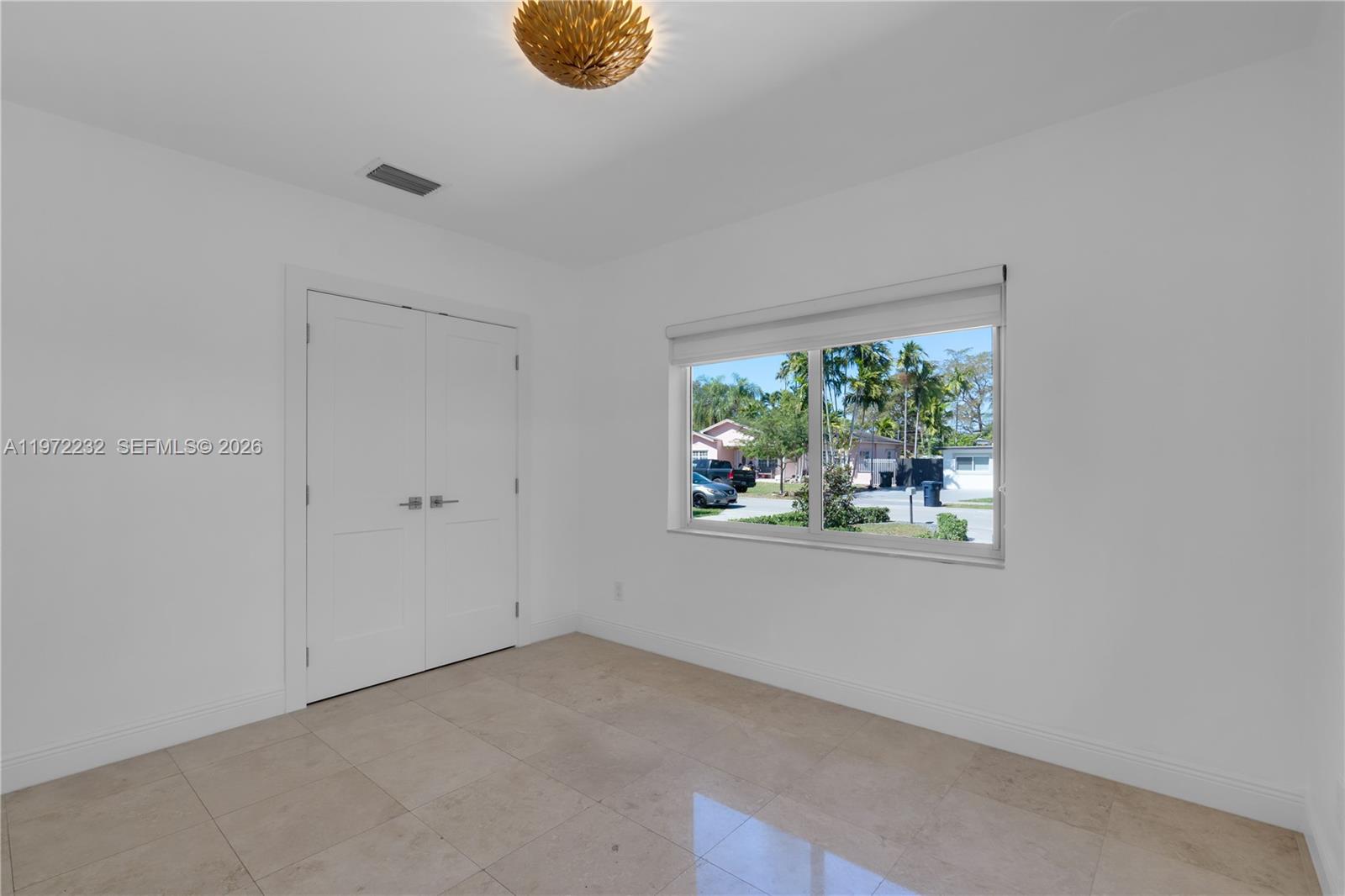 6376 Southwest 20th Street Miami, FL 33155 - Photo 22 of 42 an empty room with windows