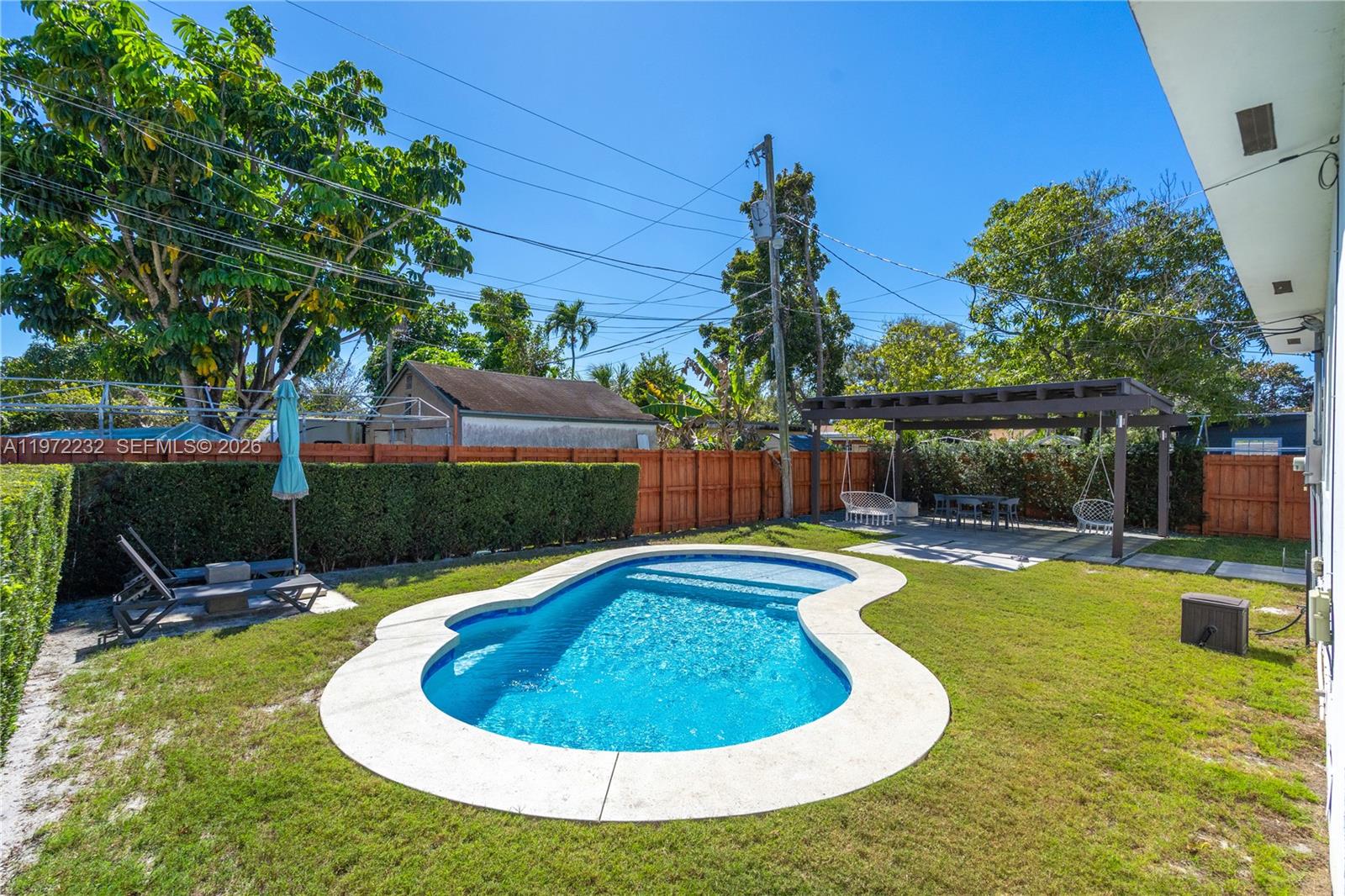 6376 Southwest 20th Street Miami, FL 33155 - Photo 28 of 42 a swimming pool with outdoor seating yard and barbeque oven