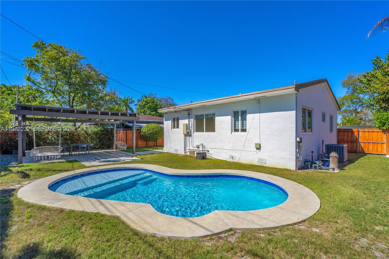 6376 Southwest 20th Street Miami, FL 33155 - Photo 29 of 42 a view of pool with lawn chairs and plants