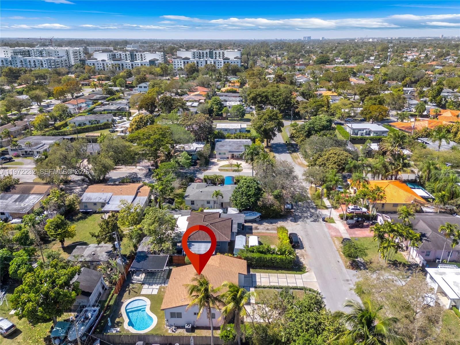 6376 Southwest 20th Street Miami, FL 33155 - Photo 38 of 42 an aerial view of a city with lots of residential buildings ocean and mountain view in back