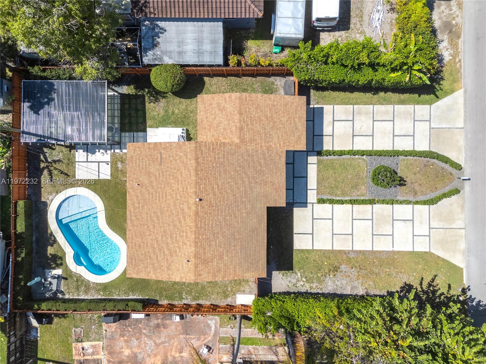 6376 Southwest 20th Street Miami, FL 33155 - Photo 41 of 42 a view of a swimming pool with a yard