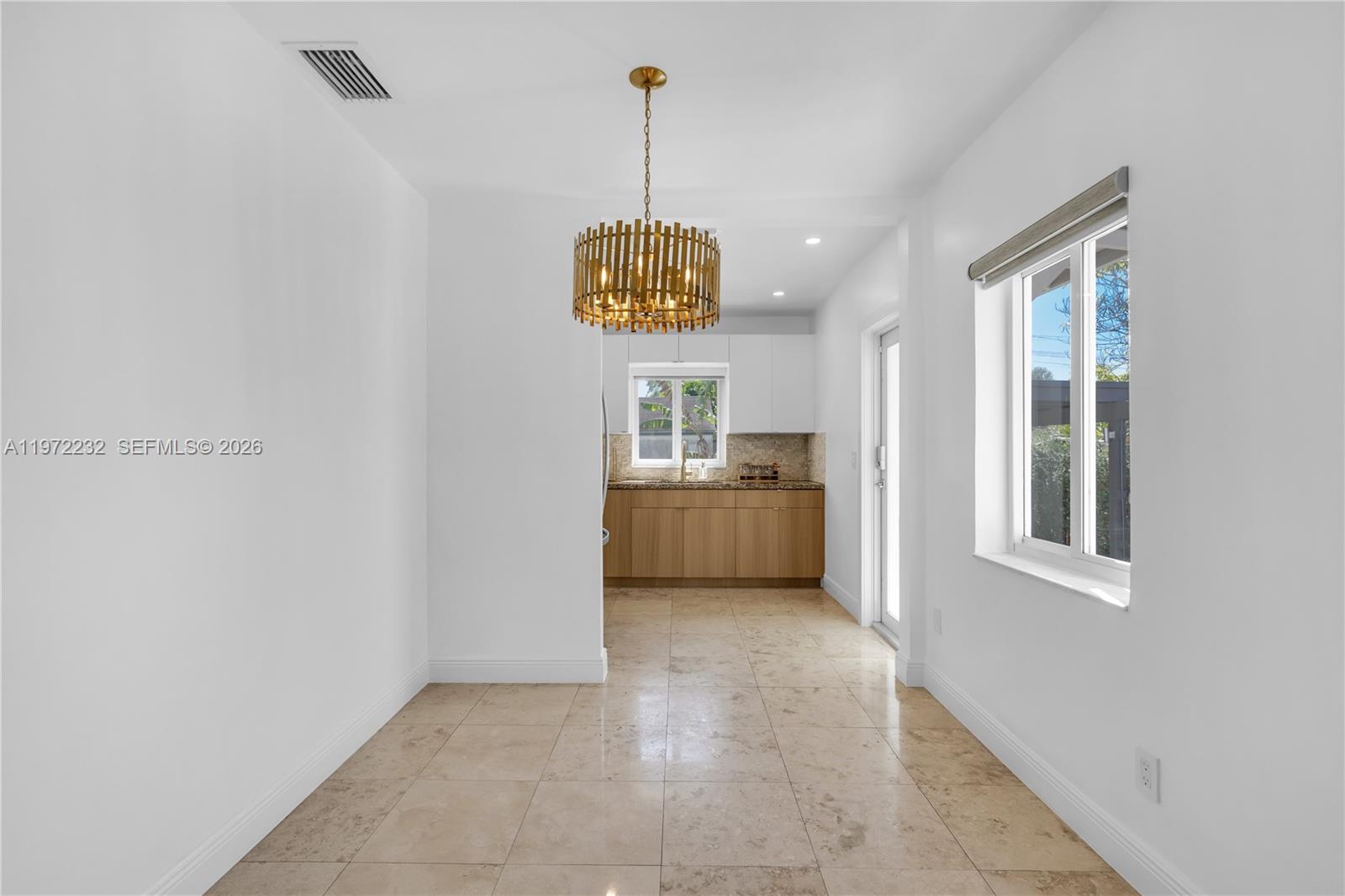 6376 Southwest 20th Street Miami, FL 33155 - Photo 10 of 42 a view of a room with cabinet and windows