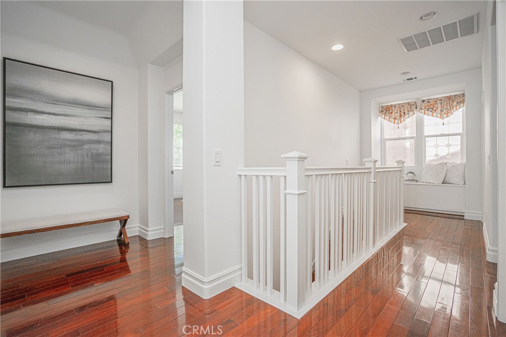 17 Mt Vernon Irvine, CA 92620 - Photo 11 of 25 a view of a hallway with wooden floor and stairs