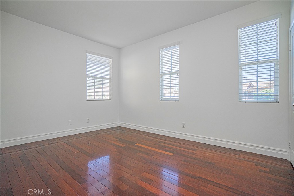 17 Mt Vernon Irvine, CA 92620 - Photo 12 of 25 an empty room with wooden floor and windows
