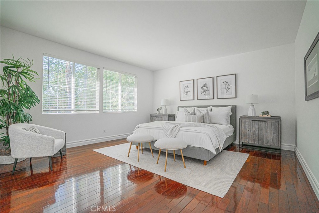 17 Mt Vernon Irvine, CA 92620 - Photo 13 of 25 a spacious bedroom with a bed windows and a couch