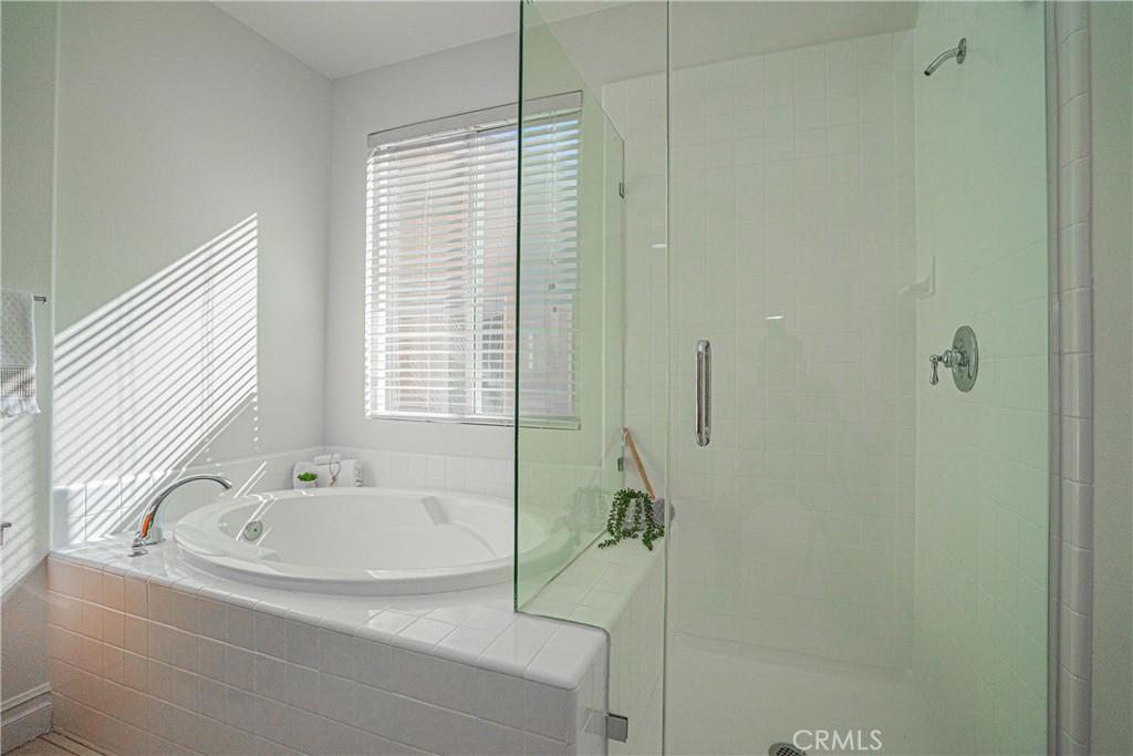 17 Mt Vernon Irvine, CA 92620 - Photo 15 of 25 a bathroom with a tub and a shower