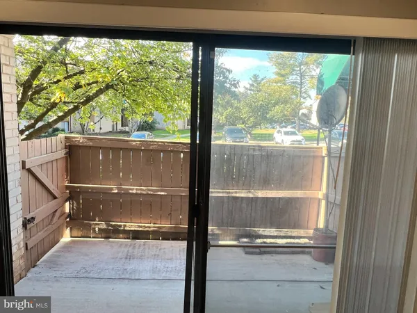 a view of room with window and door