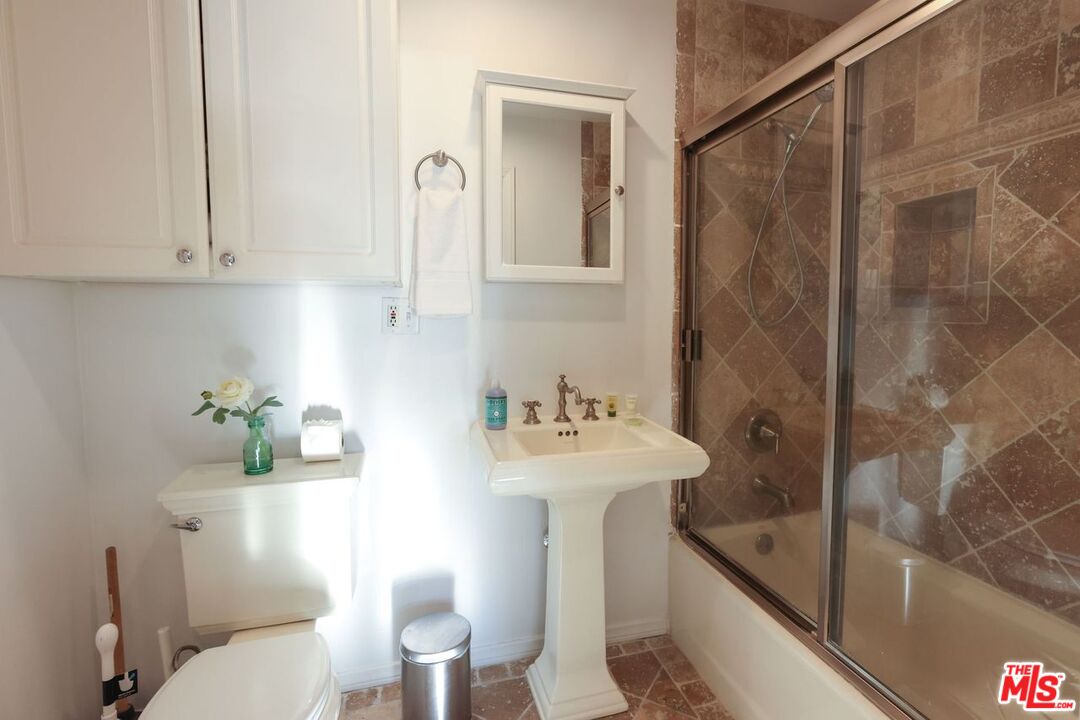 2101 Ocean Avenue, Unit 1 Santa Monica, CA 90405 - Photo 11 of 11 a bathroom with a sink a toilet and shower