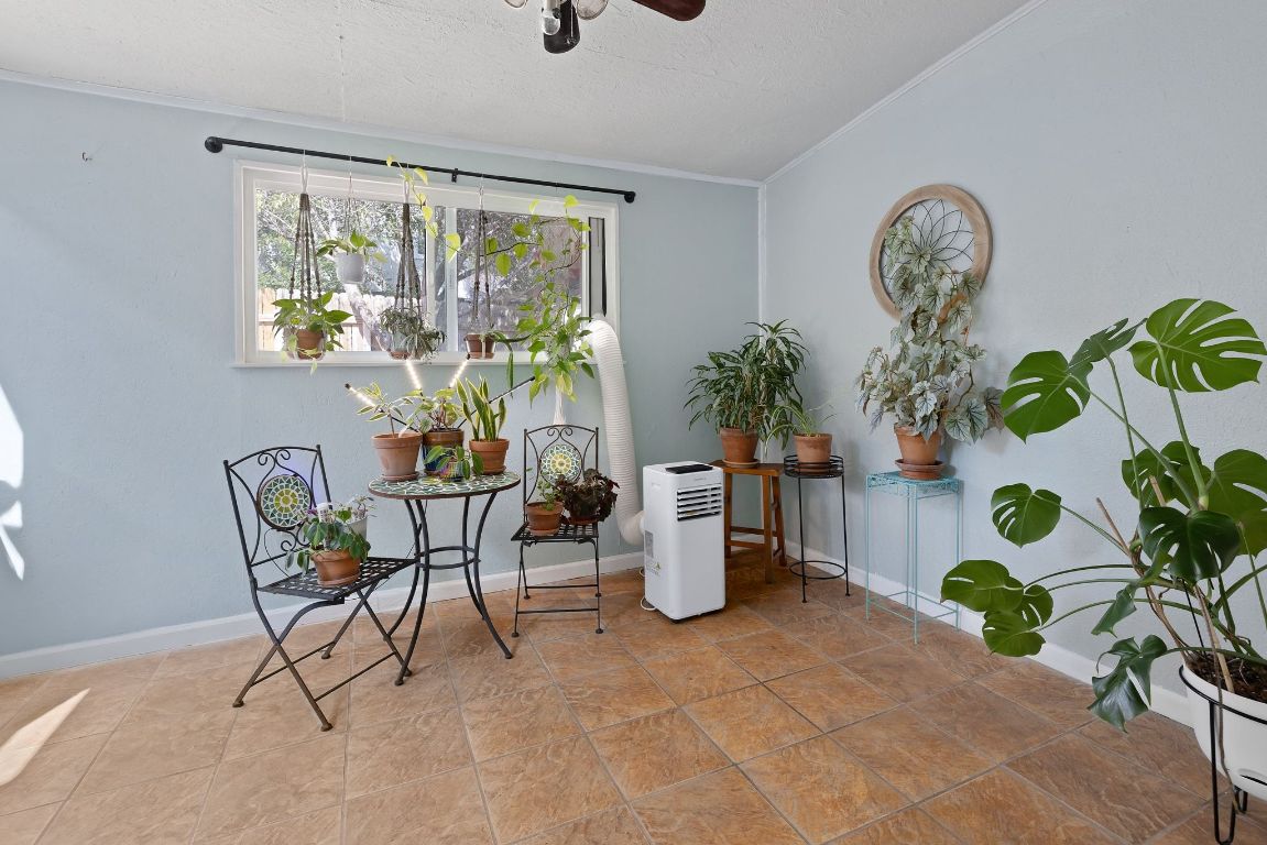 8906 Trone Circle, Unit A Austin, TX 78758 - Photo 17 of 33 a view of a dining room with furniture window and flowerpot