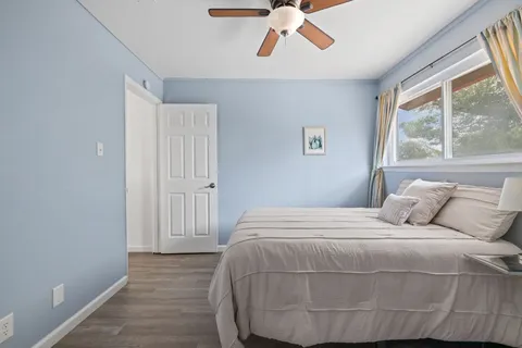 a bedroom with a bed and window