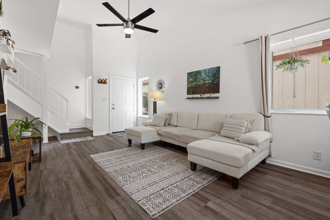 8906 Trone Circle, Unit A Austin, TX 78758 - Photo 7 of 33 a living room with furniture and a flat screen tv