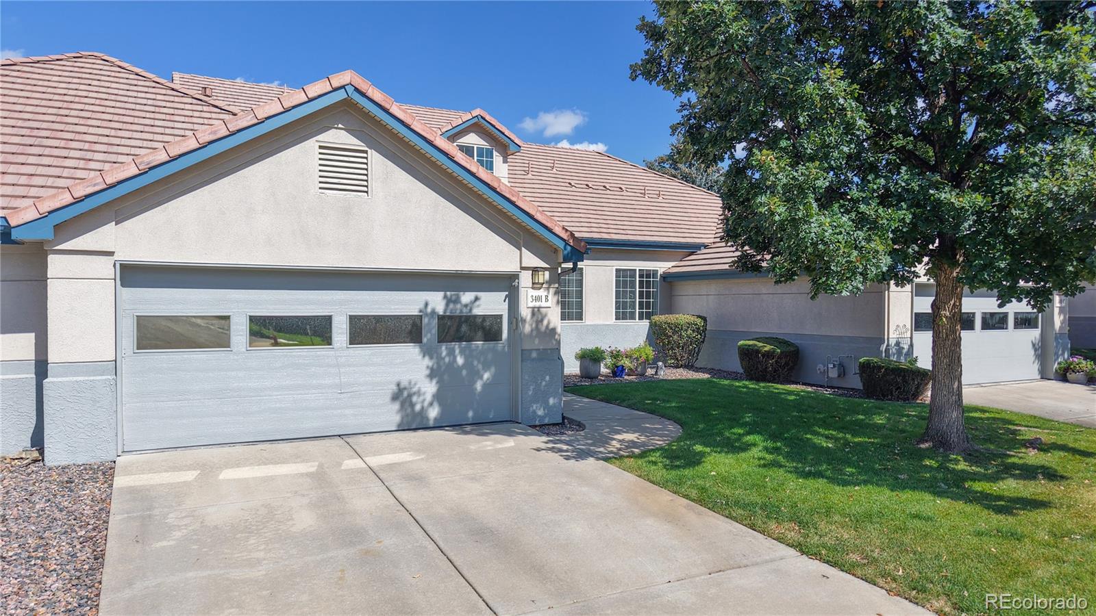 a view of a white house with a yard