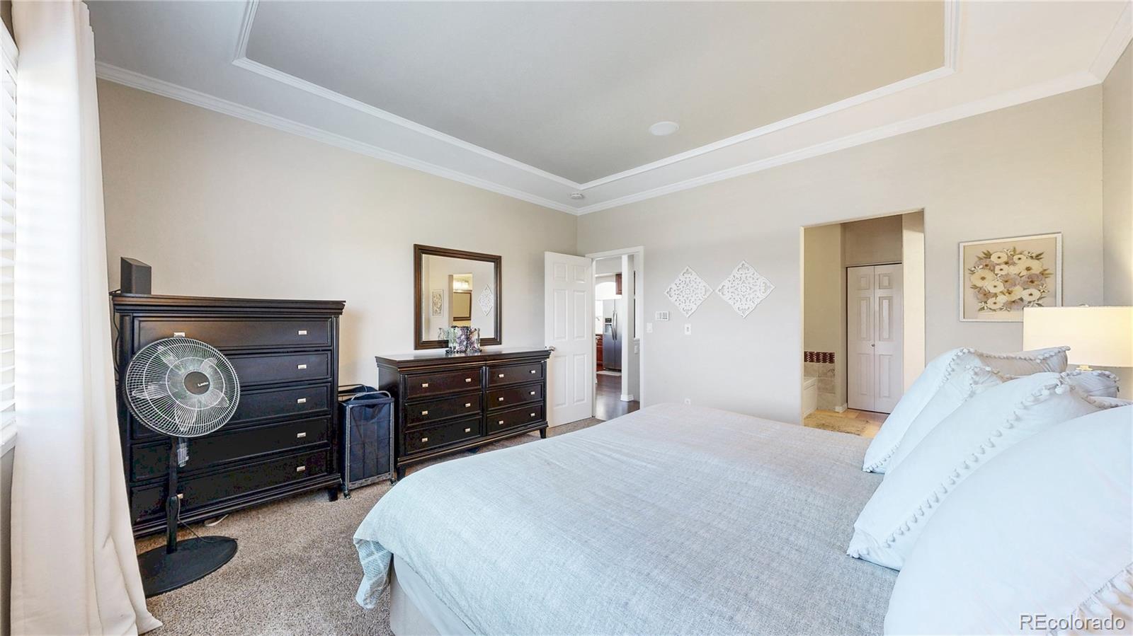3401 West 111th Loop, Unit B Westminster, CO 80031 - Photo 12 of 40 a bedroom with a bed and a closet
