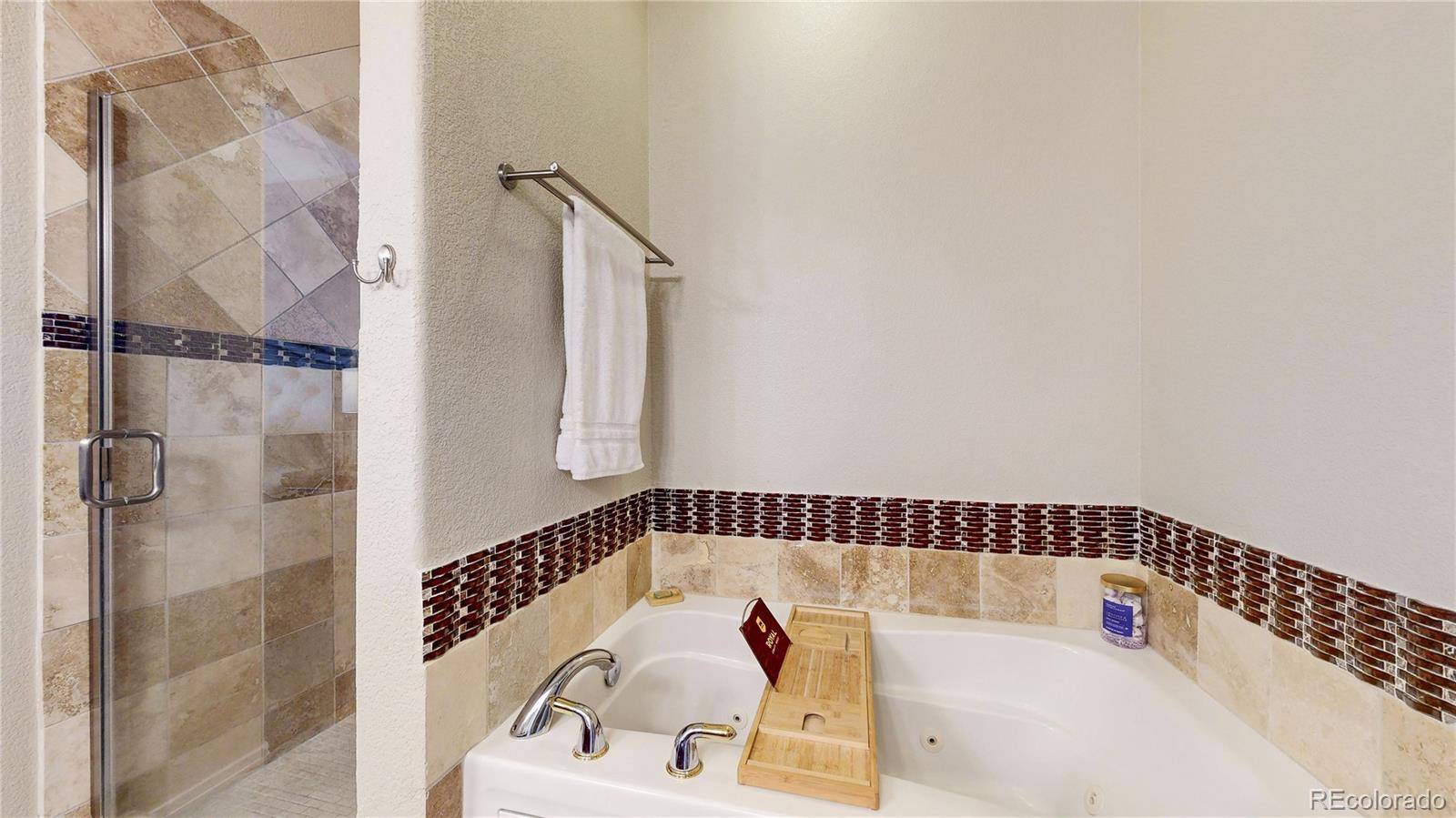 3401 West 111th Loop, Unit B Westminster, CO 80031 - Photo 15 of 40 a bathroom with a bathtub and shower