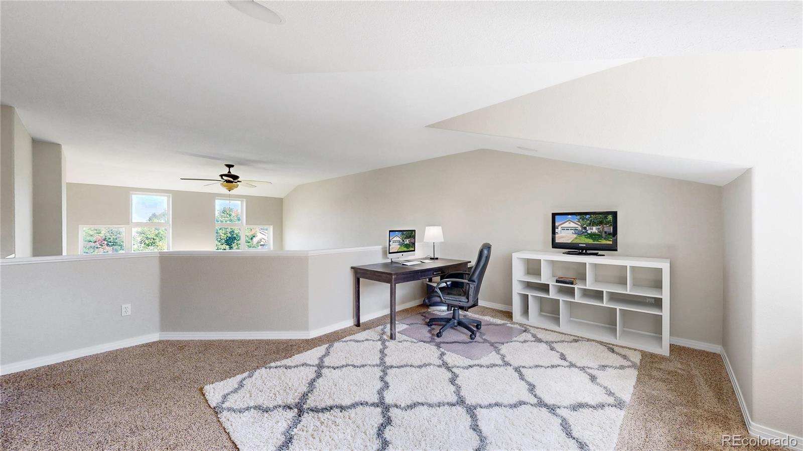 3401 West 111th Loop, Unit B Westminster, CO 80031 - Photo 17 of 40 a workspace with furniture and window