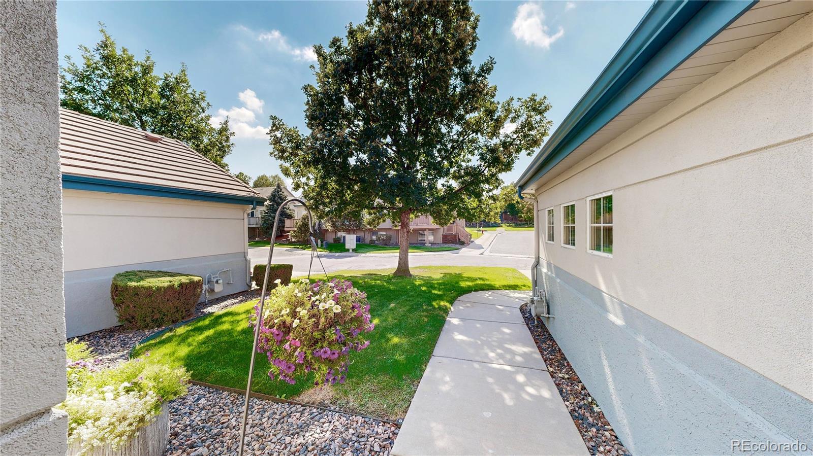 3401 West 111th Loop, Unit B Westminster, CO 80031 - Photo 32 of 40 a front view of a house with garden