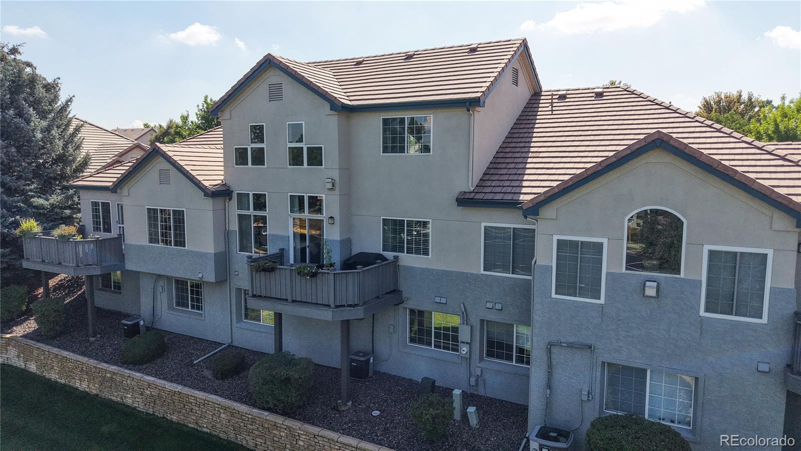 3401 West 111th Loop, Unit B Westminster, CO 80031 - Photo 37 of 40 a view of house with a deck and furniture