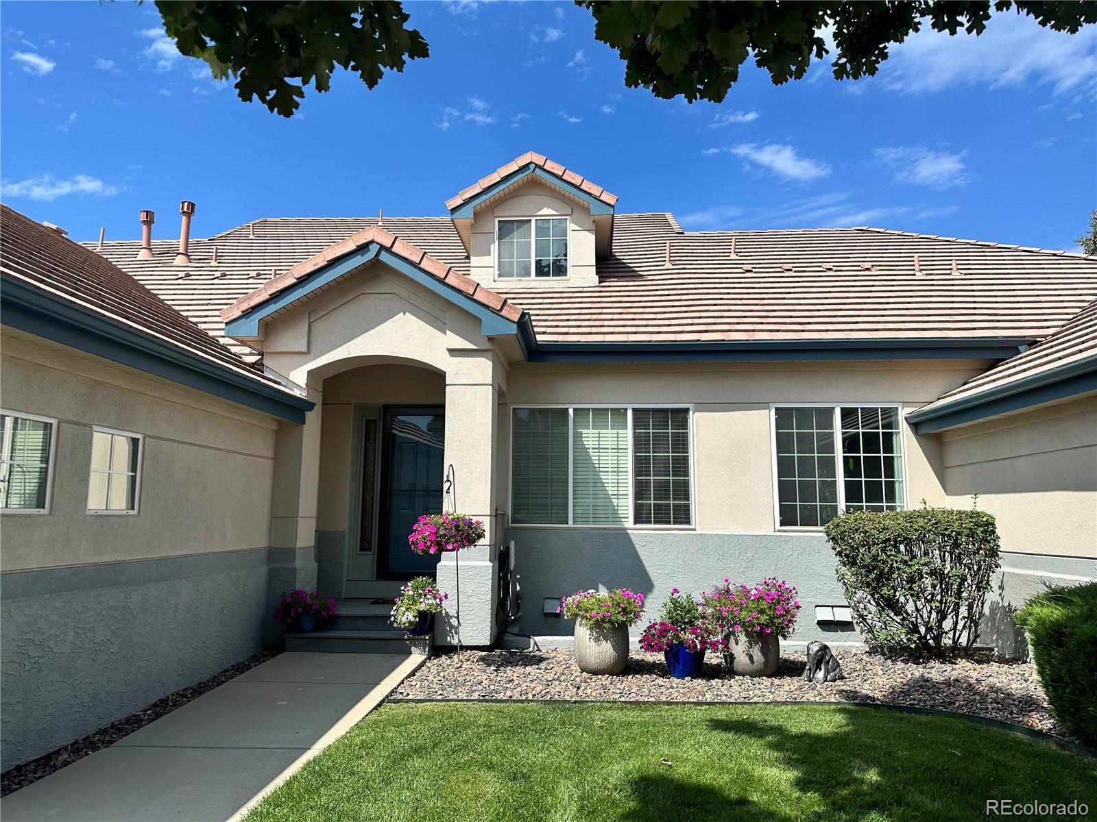 3401 West 111th Loop, Unit B Westminster, CO 80031 - Photo 40 of 40 a front view of a house with a yard