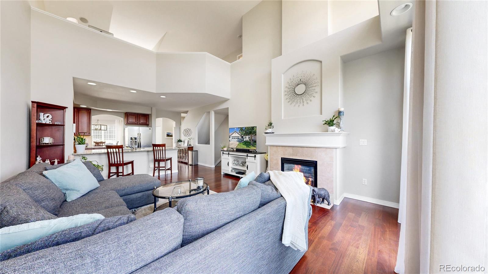 3401 West 111th Loop, Unit B Westminster, CO 80031 - Photo 4 of 40 a living room with furniture and a fireplace