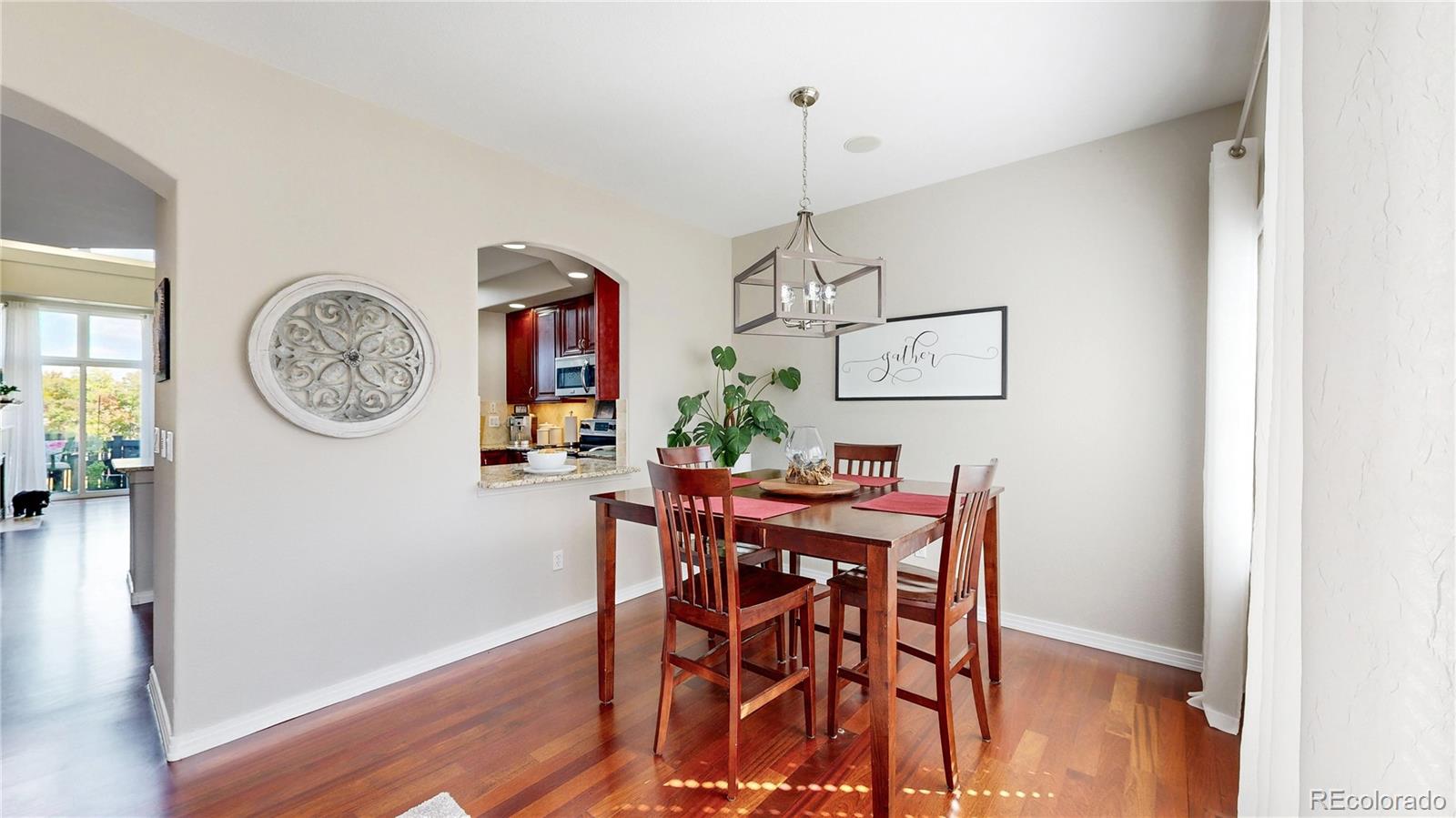 3401 West 111th Loop, Unit B Westminster, CO 80031 - Photo 9 of 40 a view of a dining area with furniture and wooden floor