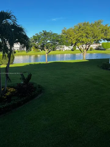 a view of a lake with a big yard