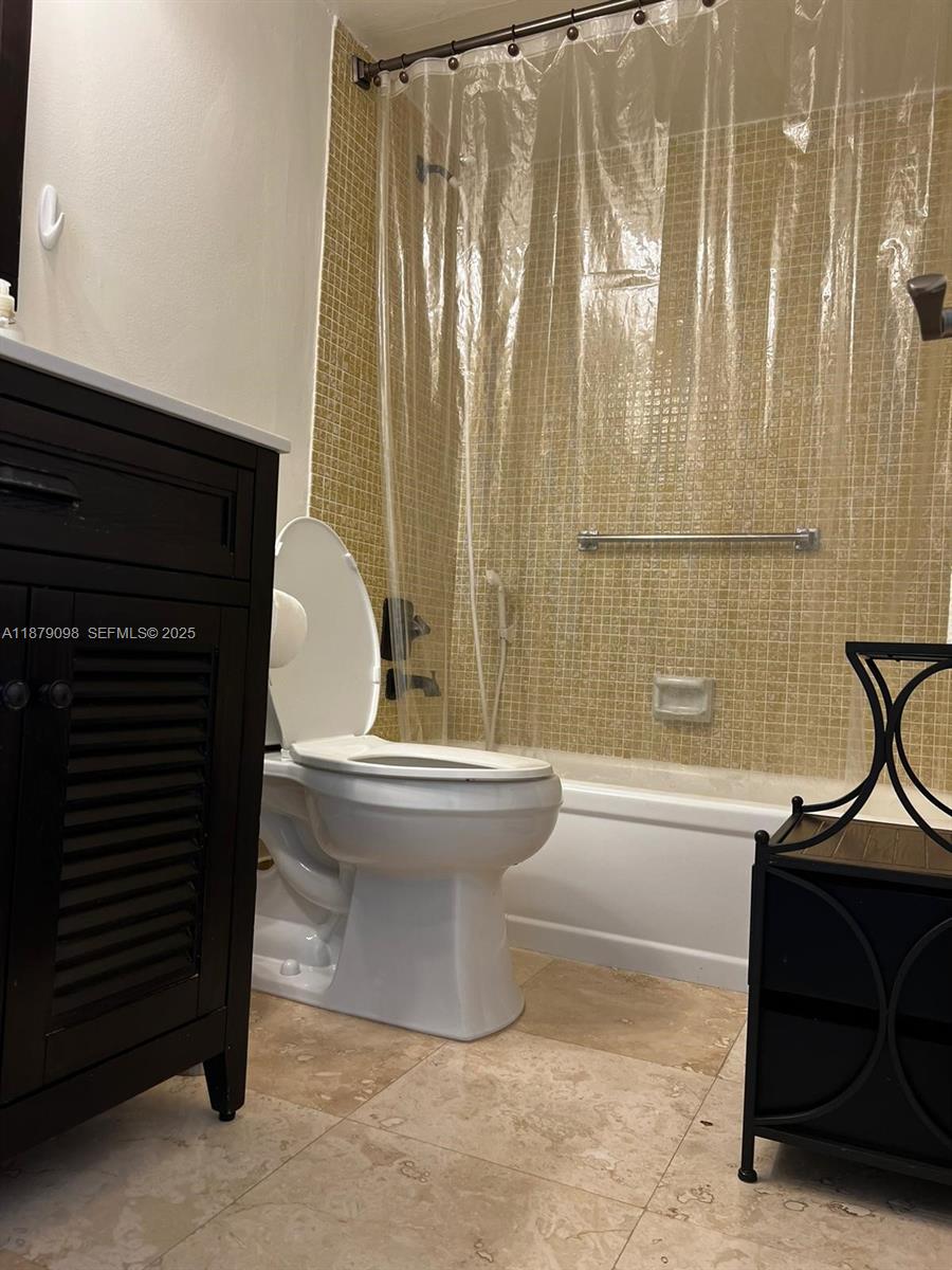 22 Brighton A, Unit 22 Boca Raton, FL 33434 - Photo 9 of 12 a bathroom with a sink and a mirror