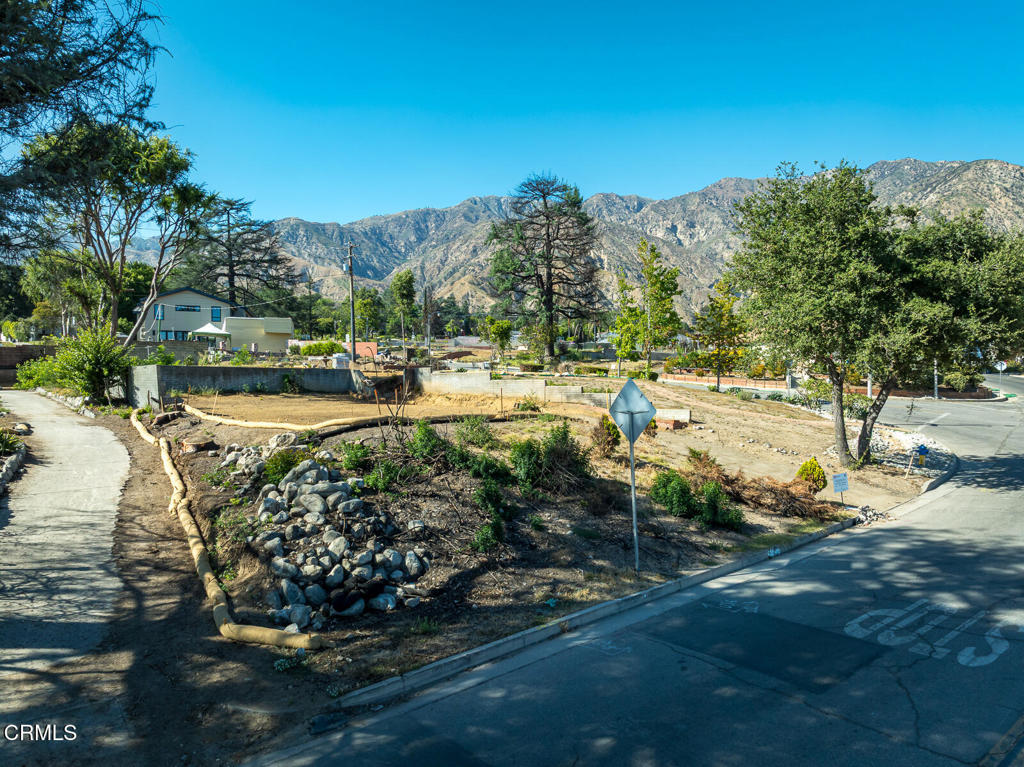 1077 East Palm Street Altadena, CA 91001 - Photo 16 of 44 a view of a yard with table and chairs