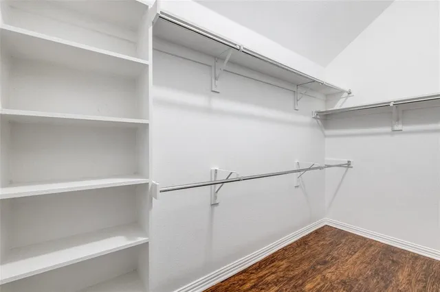 a view of an empty walk in closet