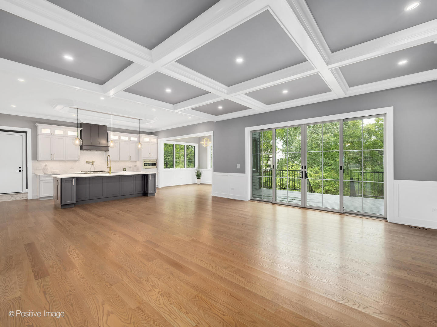 11480 Circle Drive Burr Ridge, IL 60527 - Photo 7 of 53 a view of an empty room with wooden floor and a kitchen