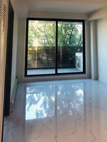 a view of a room with a large window