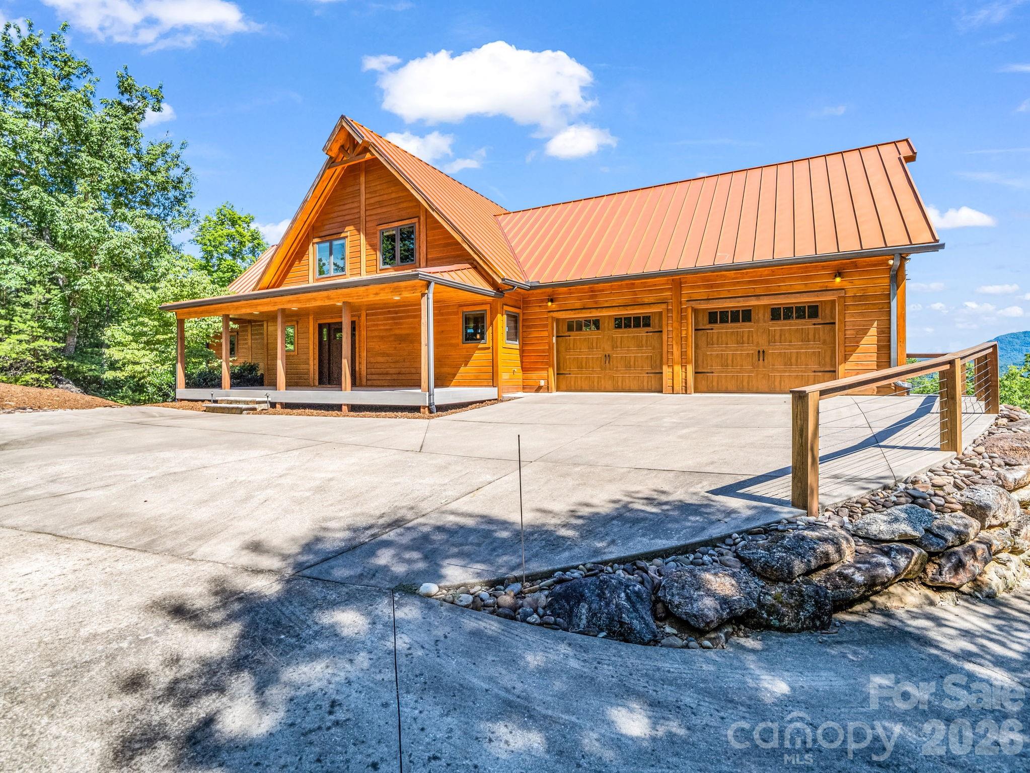 590 Boulder Ridge Lake Lure, NC 28746 - Photo 5 of 48 a front view of a house with a yard