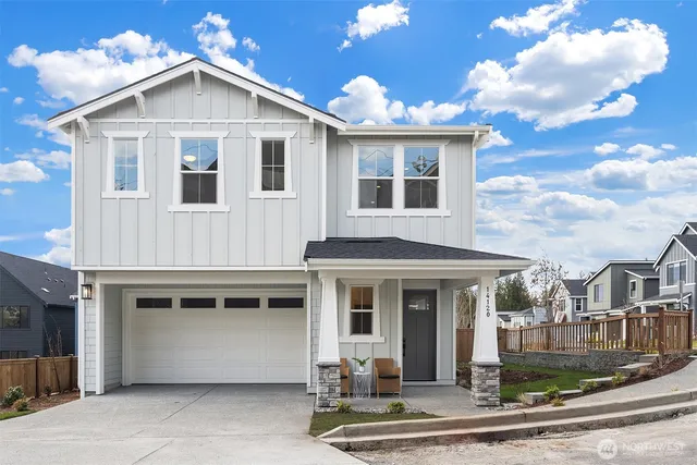 a front view of a house with yard