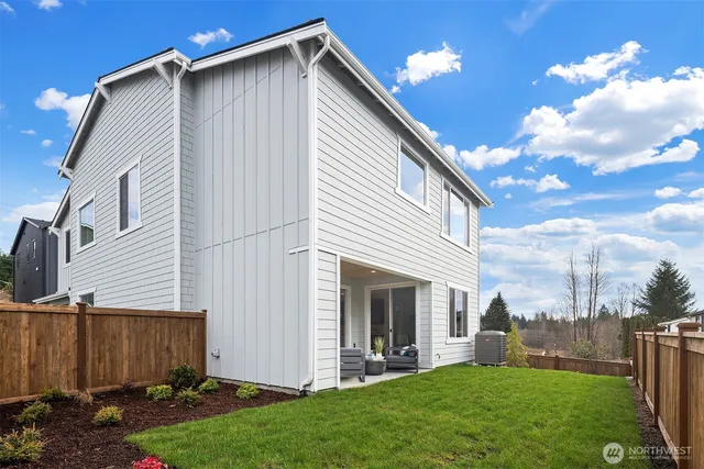 a backyard of a house with lots of green space